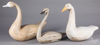 Three carved and painted swan decoys