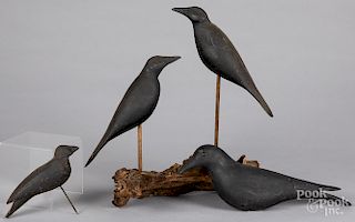 Four carved and painted crow decoys