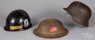 Three military helmets