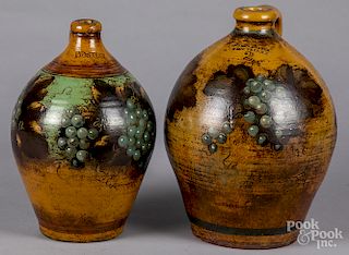 Two Peter Ompir painted stoneware jugs