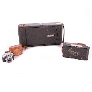 Two Eastman Kodak folding pocket cameras and a micro miracle No. 2.