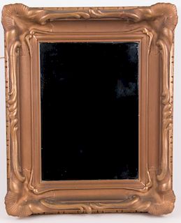 An Art Nouveau gilt framed mirror.