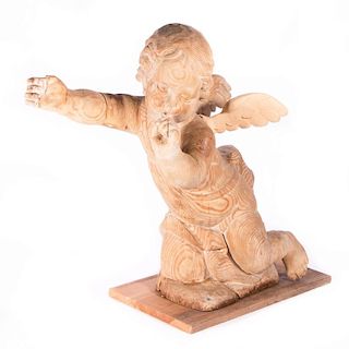 A carved wood cherub.