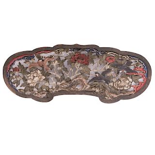 A carved Japanese wood panel.