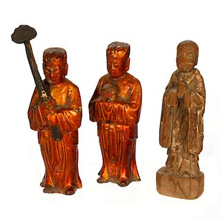 Three carved Chinese figures.
