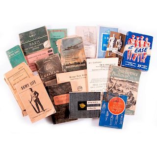 A collection of WWII pamphlets and books.