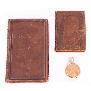Two 19th century books and a locket.