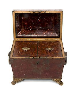 * A Regency Tole Painted Tea Caddy Height 7 x width 6 3/4 x depth 3 5/8 inches.