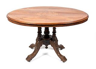 A Victorian Marquetry Tilt-Top Table Height 27 x width 45 1/2 x depth 34 inches.