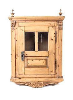 An American Carved Pine Wall Cupboard Height 41 x width 28 1/2 x depth 15 1/2 inches.
