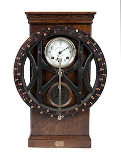 * An Oak and Cast Iron Time Keeper's Clock Height 35 x width 24 x depth 17 inches.