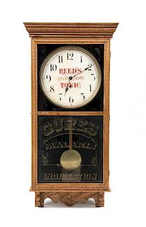 * An American Oak Advertising Wall Clock Height 38 x width 18 x depth 4 1/2 inches.