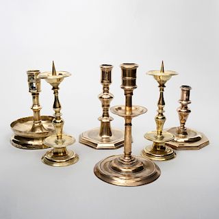 Group of Four Continental and English Baroque Bronze Candlesticks