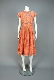CAROLYN SCHNURER FIRST COLLECTION SERRANO PRINTED DAY DRESS, 1950s.