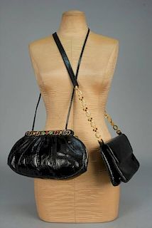 TWO JUDITH LEIBER BLACK REPTILE BAGS with CABOCHONS.