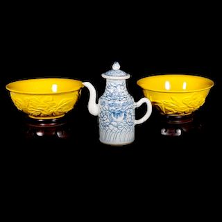 Two Chinese Peking glass bowls and a porcelain tea pot.