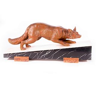 A cast bronze sculpture of a fox.