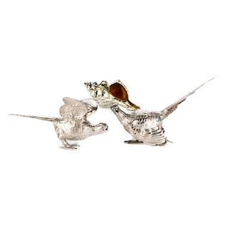 Two silver plate pheasants and a conch shell.