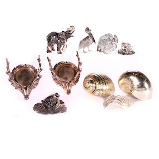 A collection of silver plate figures and shells.