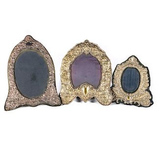 Three continental silver and gold wash picture frames.