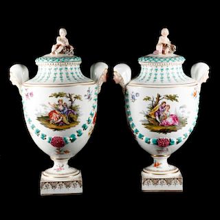 A pair of late 19th century continental porcelain urns.