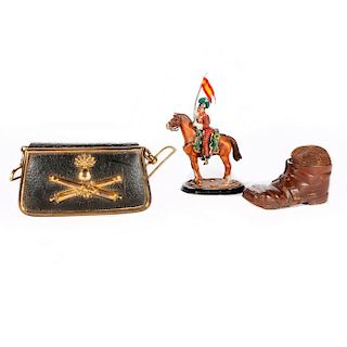 A cast French toy soldier, a tobacco box and an ammunition case.