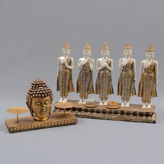 Lote de 2 Candelabros. Origen oriental. Siglo XX. Consta de: Candelabro con 5 Budas y candelabro con cabeza de buda.