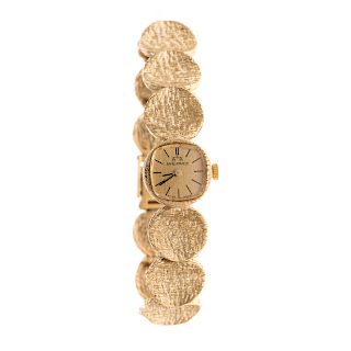 A Ladies Swiss Balance Watch in 14K Gold