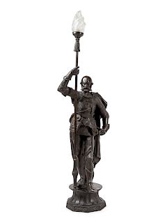 A Cast Metal Figural Newel Post Lamp