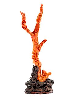 A Chinese Carved Coral Figure