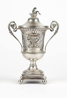 A Continental silver lidded urn with crystal liner