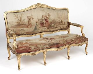 A Louis XV style carved giltwood canape