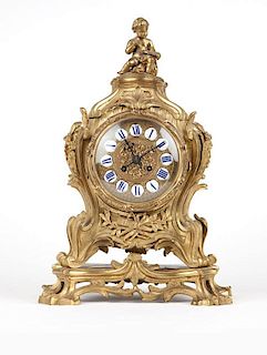 A Louis XV style gilt-bronze mantle clock