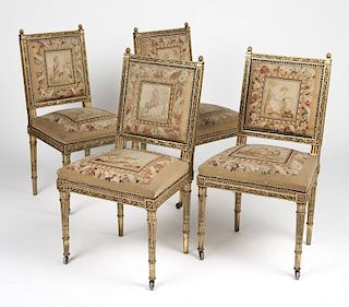 Four Louis XVI style carved and gilt wood chairs
