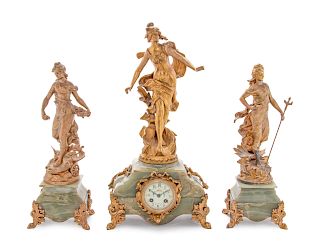 A French Onyx and Gilt Metal Clock Garniture
