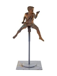 A Patinated Bronze Figure of a Boy