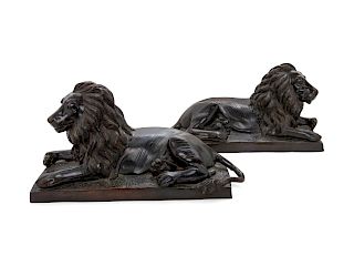 A Pair of Bronze Models of Recumbent Lions
