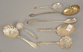 Seven piece Sterling silver lot to include scalloped medallion spoon, and reticulated serving spoons, etc. 17.4 troy ounces.