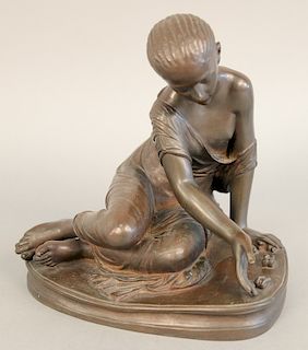 After Ferdinand Barbedienne (1810 - 1892), bronze teenager playing with stones, probably 1890-1910. ht. 9 1/2 in.