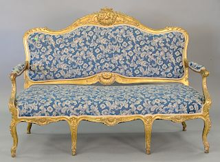 French Louis XV style settee with gilt carved frame and blue upholstery. ht. 44 in., wd. 62 in.