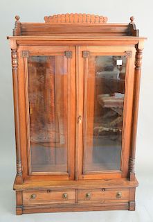 Victorian cherry two door bookcase with two drawers. ht to top of back: 65 1/2 in., wd. 42 in.