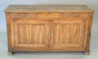 Continental oak sideboard having doors and drawers and a raised panel back, interior with grain and blue paint, 18th century. ht. 31...