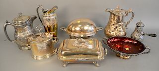 Eight piece silver plated lot with revolving tureen, covered vegetable dish, pitchers, ruby glass bowl with silver plated holder, et...