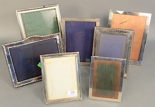 Group of seven silver picture frames to include three sterling silver and three English silver, inside 7" x 5" to 9 1/2" x 7 1/4"