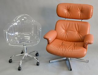 Two piece lot to include Eames style lounge chair with leather upholstery along with clear plastic swivel chair.