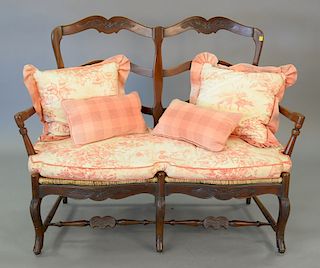 Louis XV style settee with rush seat and custom upholstered cushion. ht. 40 1/2 in., wd. 52 1/2 in.