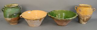 Group of four French earthenware pieces, two large bowls and two large confit pots or jars in green and yellow glaze, ht. 10 in. to ...