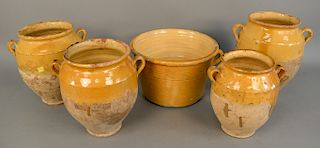 Group of five French earthenware glazed jars confit pots with handles in yellow glaze, ht. 8 1/2 in. to 12 1/2 in.