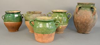 Group of five French earthenware glazed jars confit pots and jugs with handles in green glaze, ht. 9 1/4 in. to 15 1/2 in.