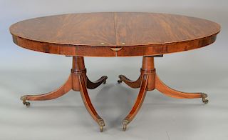Custom mahogany oval dining table with double pedestal, line inlay, and two 24 inch leaves with pads, late 19th century. ht. 30 1/2 ...